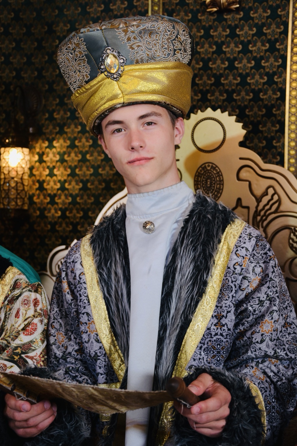 Xavier Schwindt in royal regalia, seated on a throne